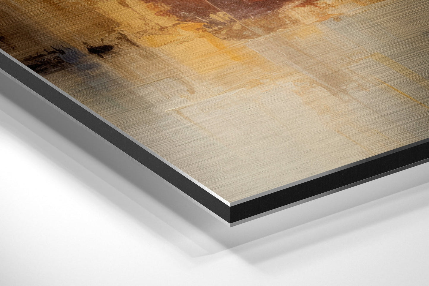 Close-up angled view of brushed aluminum dibond panel edges showing layered construction with black and white core layers beneath light wood-grain surface.