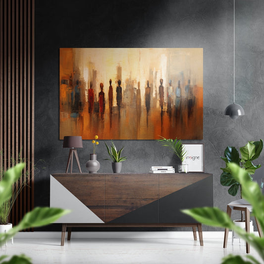 Amber Silhouette Crowd Skyline artwork displayed above wooden dresser in modern living room with gray textured wall and pendant light.