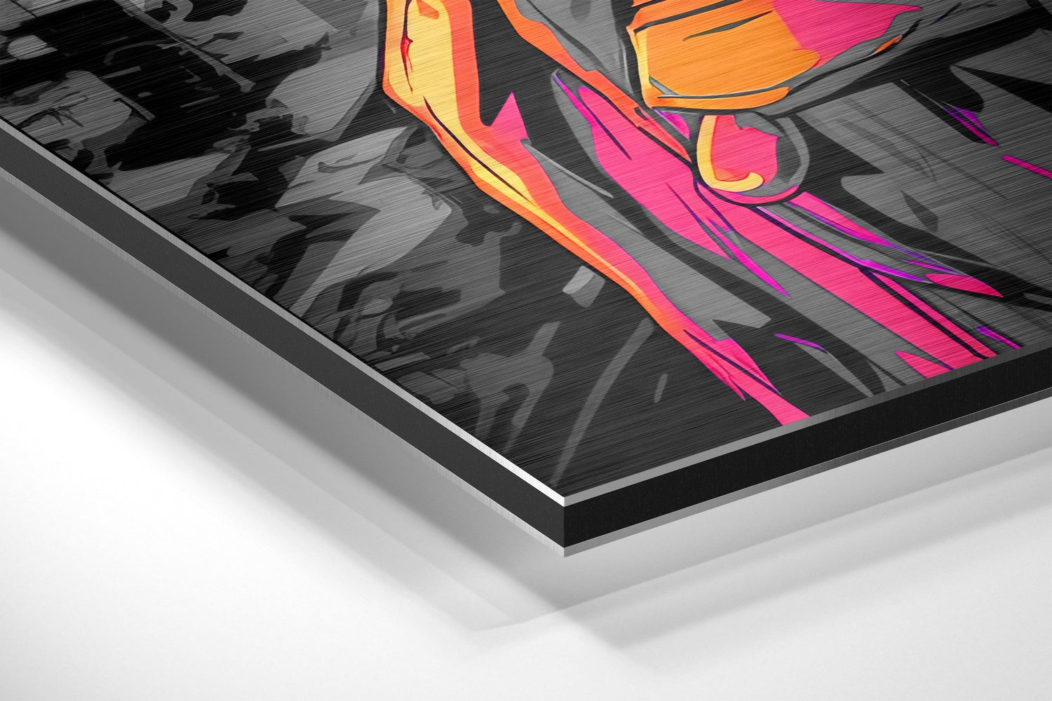 Close-up angled view of brushed aluminum Dibond wall art showing vibrant pink, orange, and yellow abstract design with black background and layered metal frame edge.
