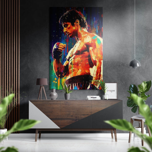 Colorful pop art portrait of shirtless boxer in profile with vibrant rainbow hues displayed above wooden console in modern interior setting.