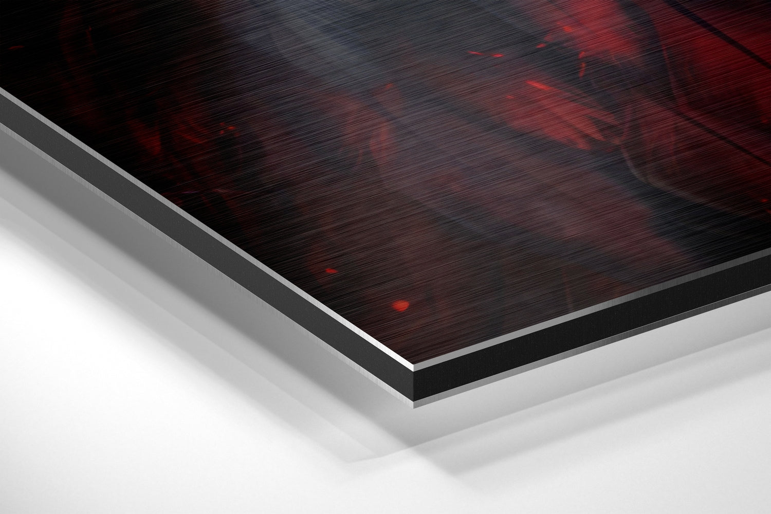 Angled perspective view of red and black brushed aluminum Dibond panel with white layered edges, showing textured surface detail.