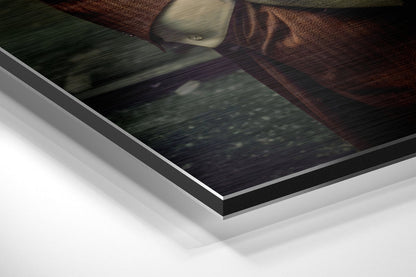 Close-up angled view of layered Dibond wall art showing white backing, black edge trim, and brushed aluminum surface with textured fabric detail visible.