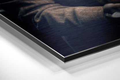 Close-up angled view of layered Dibond wall art showing brushed aluminum surface with elephant silhouette and white backing board edges.