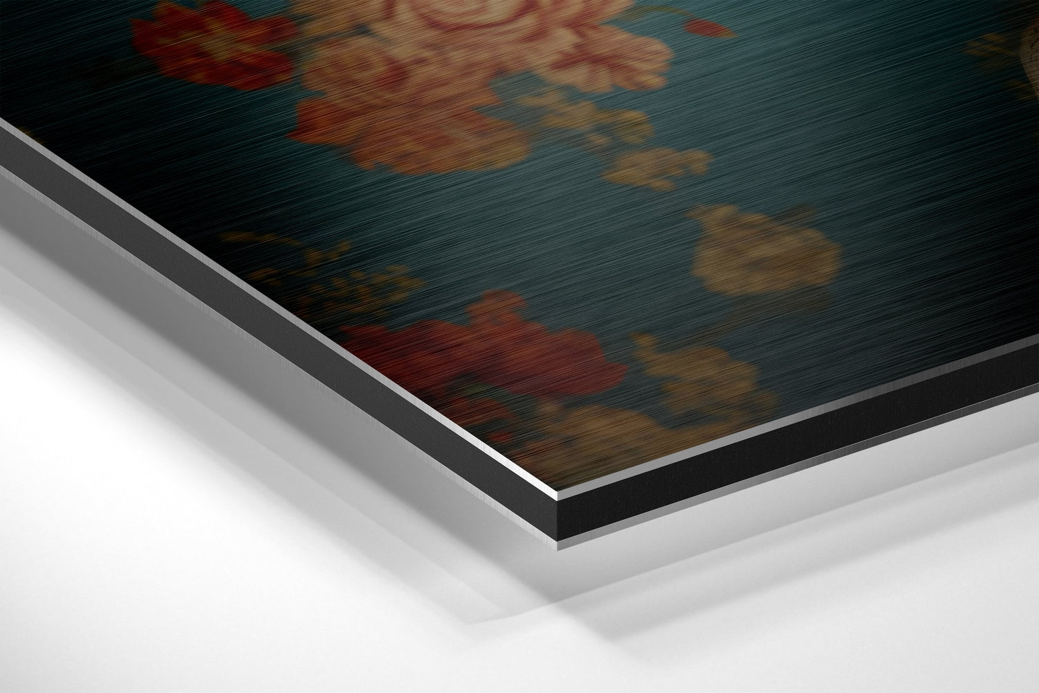 Close-up angled view of layered Dibond panel showing brushed aluminum frame with teal and rust-toned floral artwork visible on top surface.