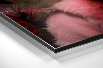 Close-up angled view of Dibond wall art with red and pink tones, showing layered aluminum and black edge framing against white background.