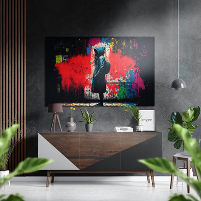 Modern living room with Confrontation Brushed Aluminum Dibond artwork mounted above wooden console, featuring silhouetted figure against red, blue, and yellow paint splashes.