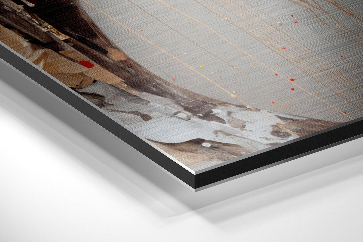 Close-up angled view of brushed aluminum Dibond wall art showing layered edges, grid pattern overlay, and brown/tan tones with red accent dots.