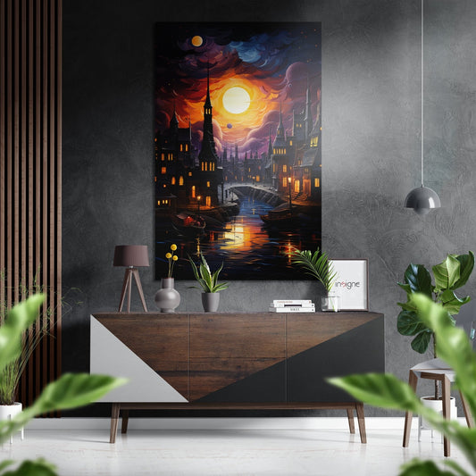 Brushed aluminum dibond artwork featuring a glowing moon over a nighttime cityscape with illuminated buildings and water reflections, displayed above a wooden dresser in a modern interior.