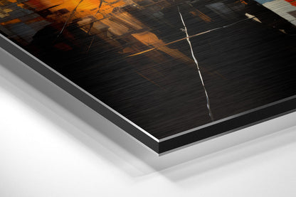 Angled product view of brushed aluminum Dibond wall art with black and orange cityscape design and white edge detail.