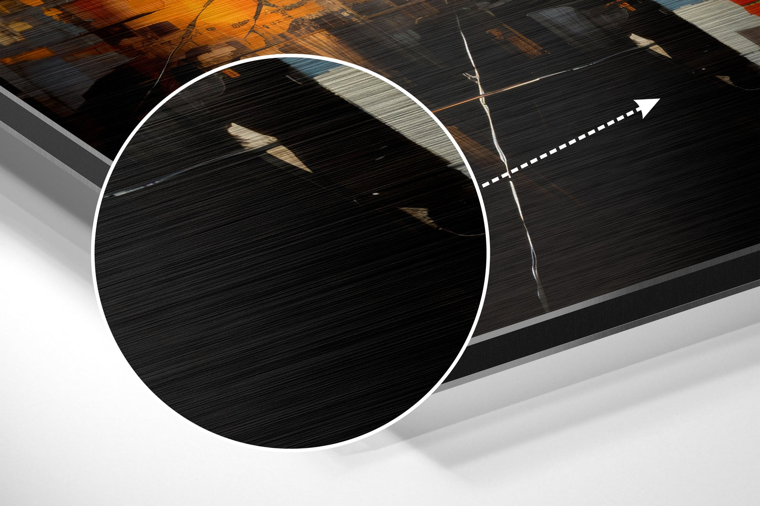 Close-up angled view of brushed aluminum dibond wall art showing textured black surface with white circular frame and directional arrow graphic.