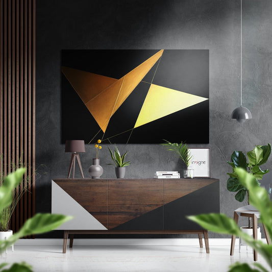 Modern living room interior featuring Pyramids Brushed Aluminum Dibond wall art with gold, bronze, and yellow geometric triangles above wooden console table.