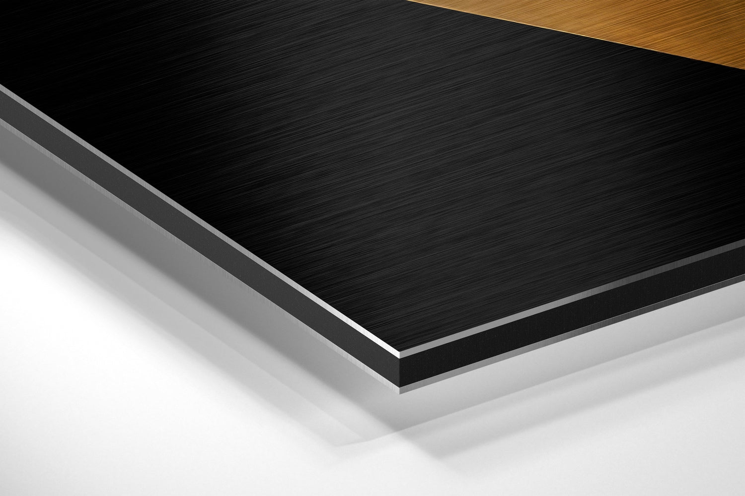 Layered diagonal view of brushed aluminum Dibond panel showing black brushed metal surface with white and gray backing layers and wood edge detail.