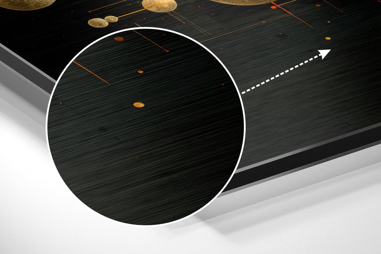 Angled perspective view of brushed aluminum wall art featuring a large white-outlined circle with textured dark surface and golden spheres suspended above.