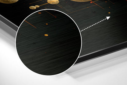 Angled perspective view of brushed aluminum wall art featuring a large white-outlined circle with textured dark surface and golden spheres suspended above.