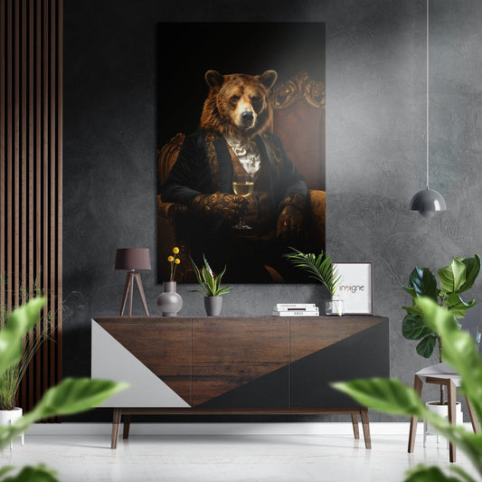 Bear gentleman portrait displayed on gray wall above wooden dresser in modern interior setting with plants and pendant light.