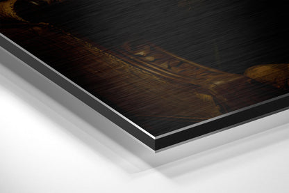 Close-up angled view of brushed aluminum dibond print edge showing layered construction with dark wood-textured top surface and white backing material.