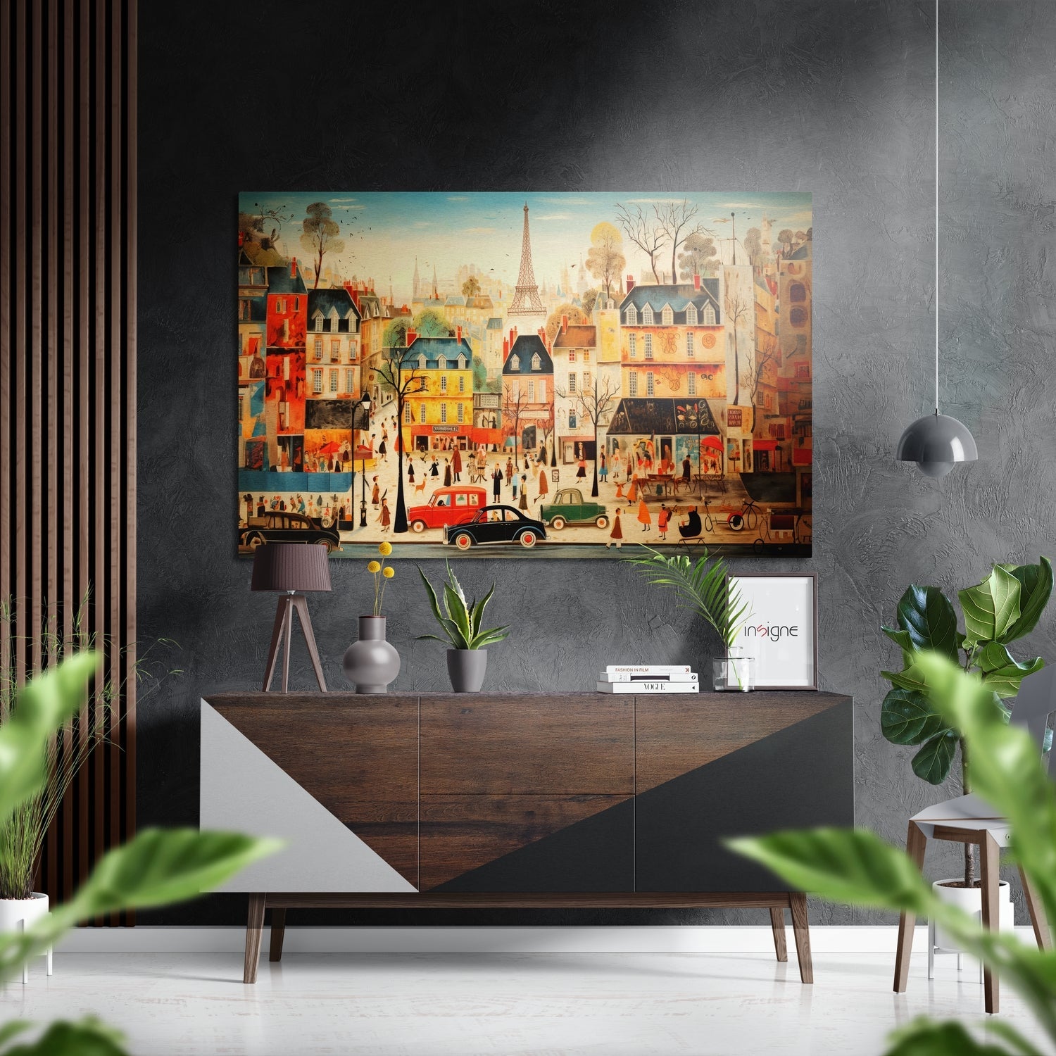 Colorful Paris street scene artwork hung above wooden mid-century dresser with potted plants and pendant lamp.