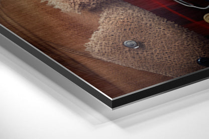 Close-up angled view of brushed aluminum Dibond wall art showing layered edge detail and brown textured dog portrait surface.