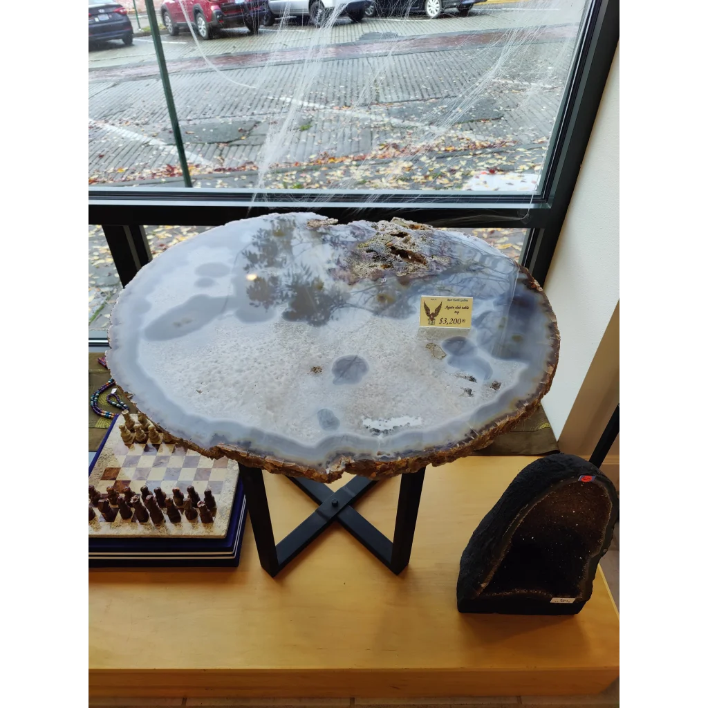 XL Agate Quartz Slab with gray center and brown edges on black stand