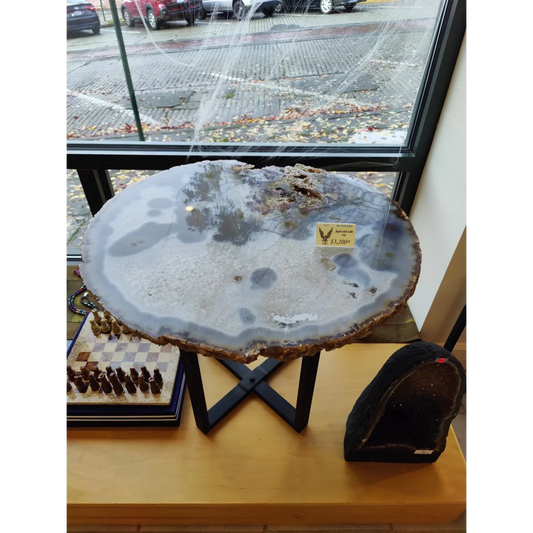XL Agate Quartz Slab with gray center and brown edges on black stand