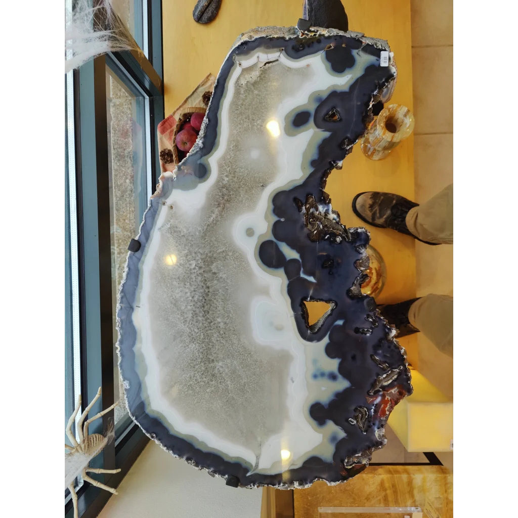 Polished agate slab end table with white and deep blue-black bands