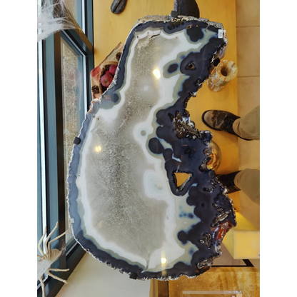 Polished agate slab end table with white and deep blue-black bands