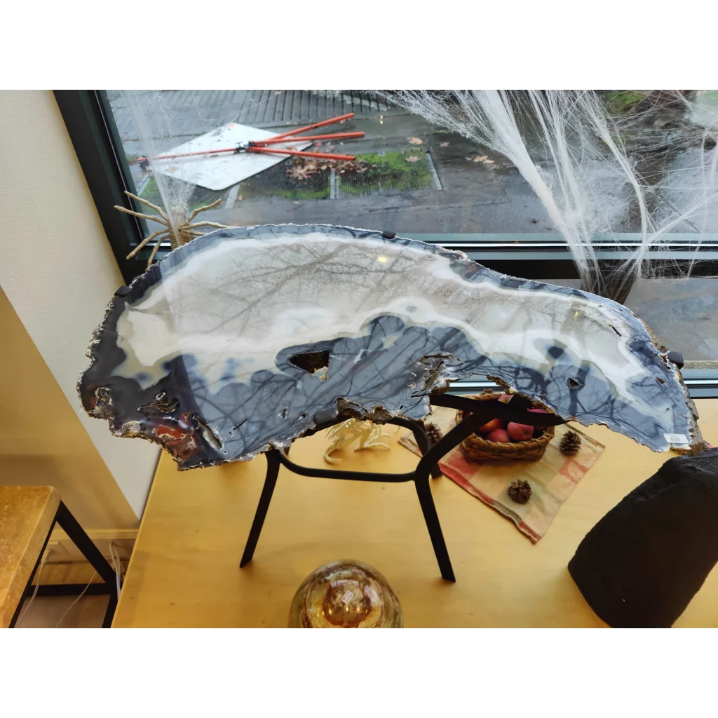 Sleek agate slab end table with swirling gray white patterns