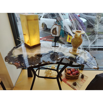 Sleek agate slab end table with polished surface, natural edge, black metal legs