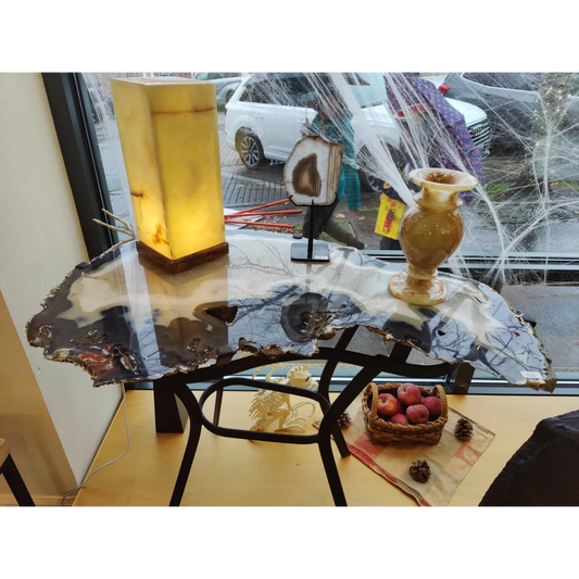 Sleek agate slab end table with polished surface, natural edge, black metal legs