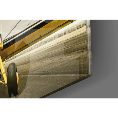 Vintage yellow biplane landing gear on glossy glass wall art