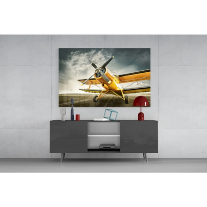 Vintage yellow biplane wall art on gray console table