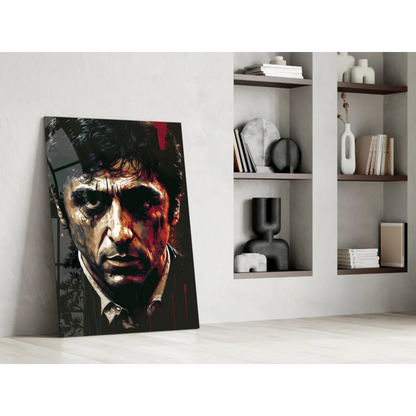 Striking red black glass wall art portrait with bold features and paint splatters