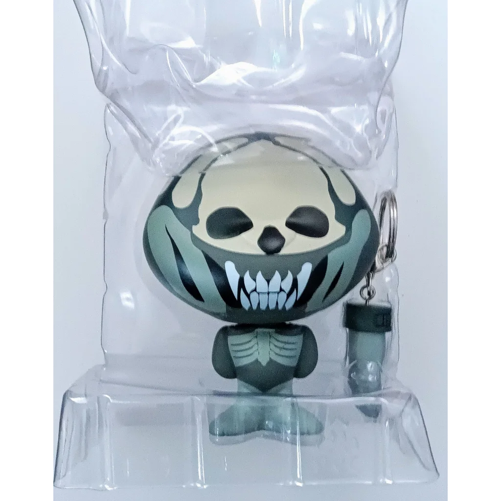 Kidrobot Alien Xenomorph vinyl figure in black and white skull design packaging