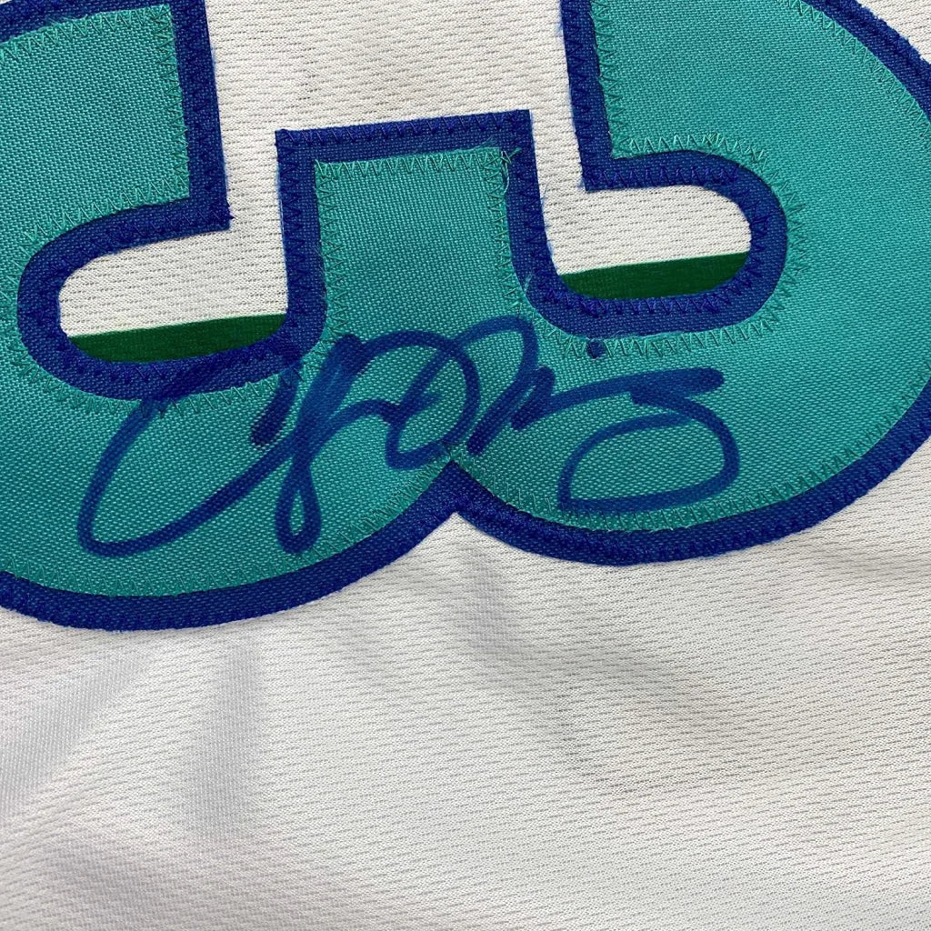 Autographed teal and blue Alonzo Mourning Hornets jersey with signature and photos