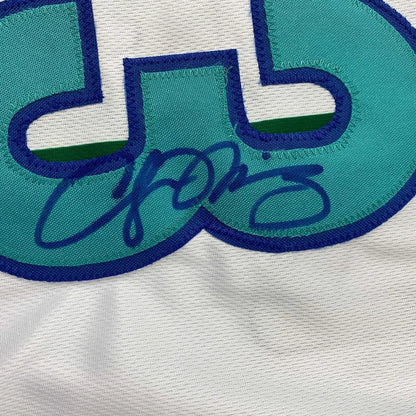 Autographed teal and blue Alonzo Mourning Hornets jersey with signature and photos