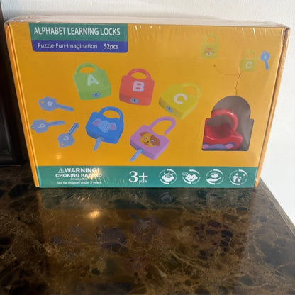 Alphabet learning lock toy set with colorful A-C locks in yellow box