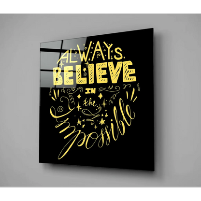 Stunning black glass wall art with gold foil quote always believe in the impossible and swirls