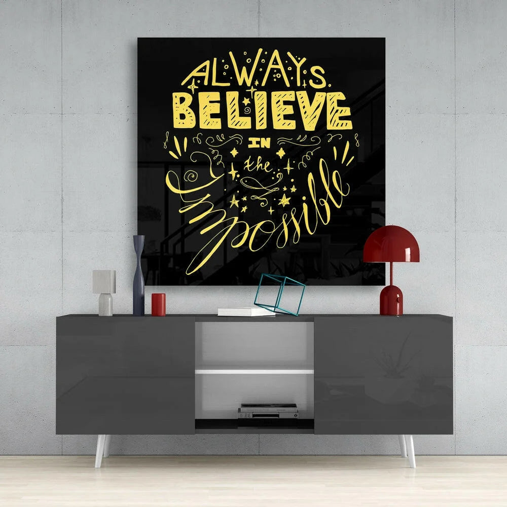 Black glass wall art with bold yellow quote always believe in the impossible, swirls, stars, dots