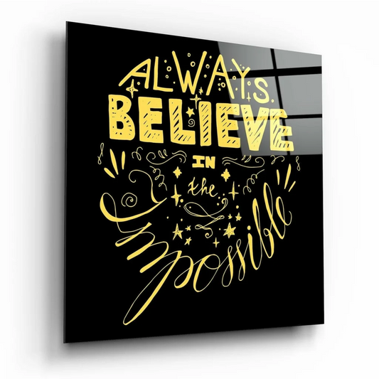 Black glass wall art with bold yellow always believe in the impossible quote