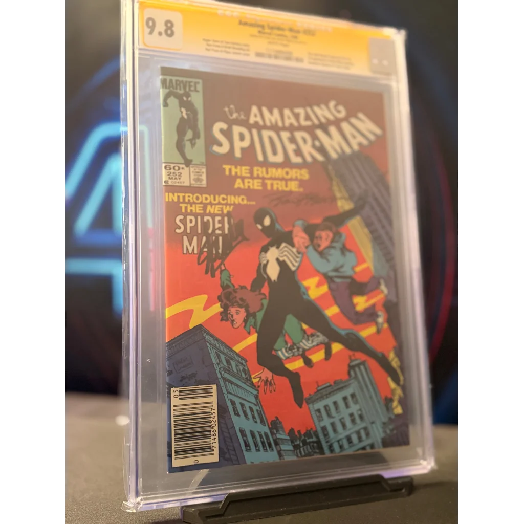 A near perfect cgc graded 9.8 signed amazing spider-man comic book with red cover featuring stan lee signature