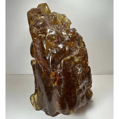 Translucent amber termite hill resin sculpture with intricate carvings