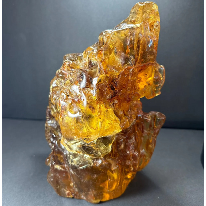 Translucent amber termite hill resin sculpture with organic texture