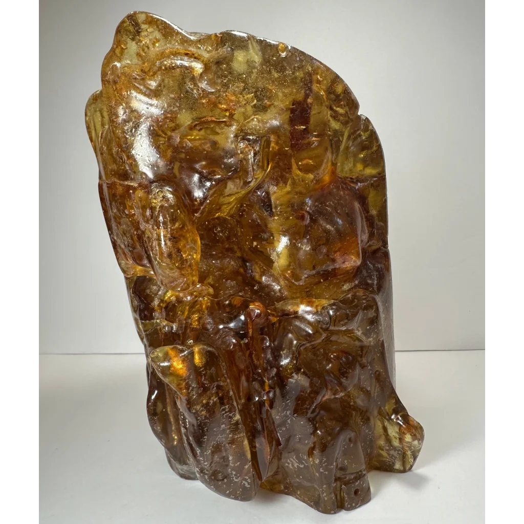 Intricate amber termite hill fossilized resin sculpture with detailed carvings