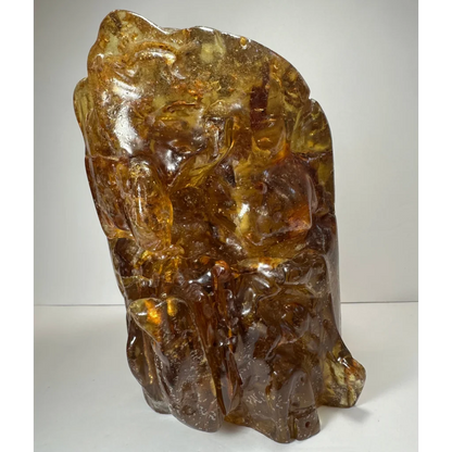Intricate amber termite hill fossilized resin sculpture with detailed carvings