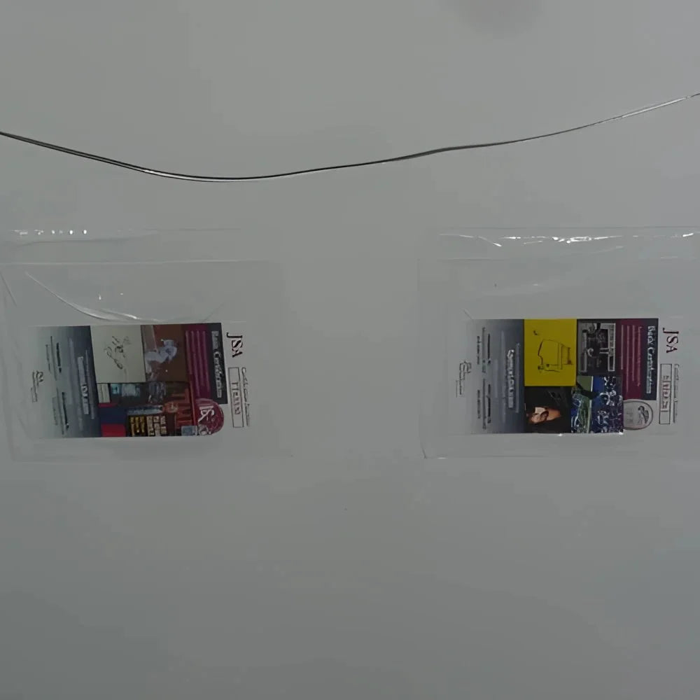 Clear plastic badge holder with American Sniper movie poster card signed by Bradley Cooper