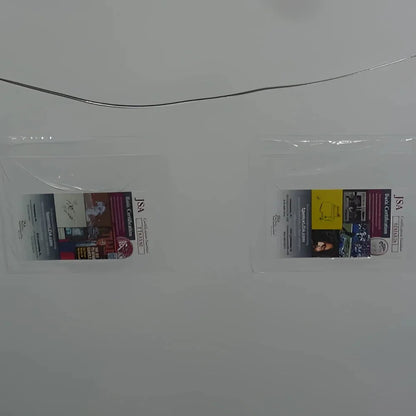 Clear plastic badge holder with American Sniper movie poster card signed by Bradley Cooper