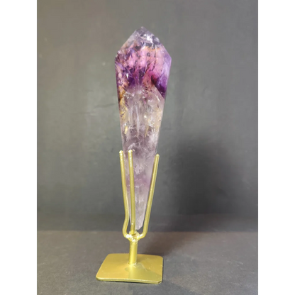 Amethyst polished scepter featuring a tall faceted crystal with purple gradient on a gold metal stand