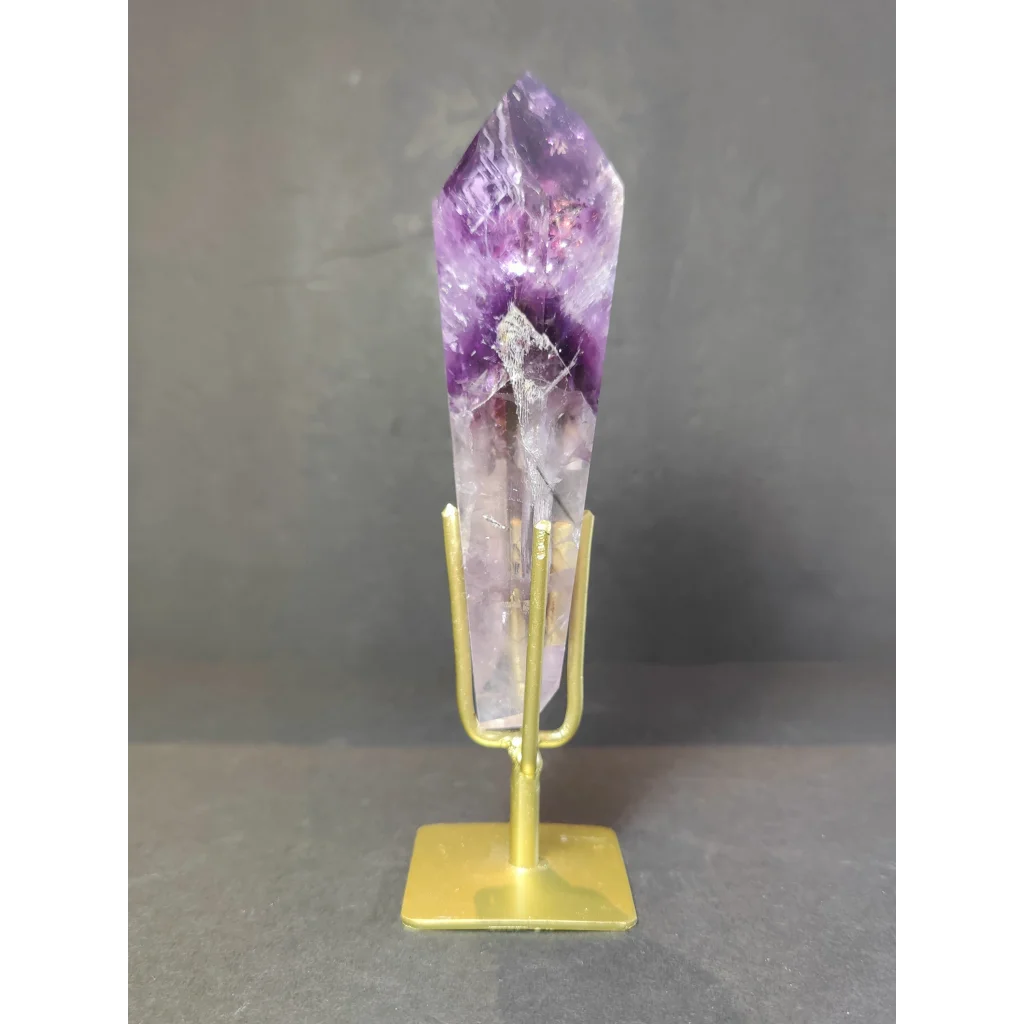 Amethyst polished scepter wand with deep purple to lavender hues mounted on gold-toned metal stand