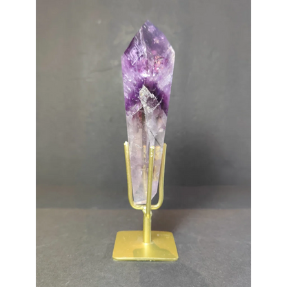 Amethyst polished scepter wand with deep purple to lavender hues mounted on gold-toned metal stand