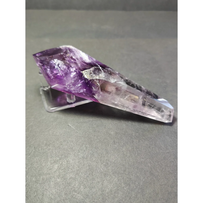 Amethyst polished scepter wand with translucent purple crystal and internal inclusions on clear acrylic metal stand